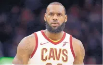  ?? TONY DEJAK/ASSOCIATED PRESS ?? Cleveland’s LeBron James leaves the court Tuesday night after being ejected for the first time in his NBA career. The Cavaliers prevailed agianst the Miami Heat anyway.