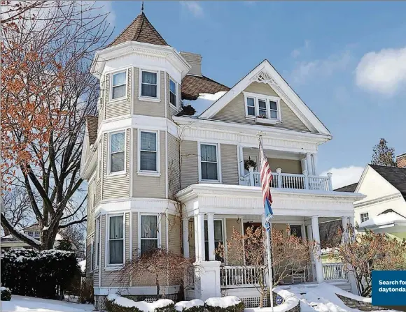  ?? CONTRIBUTE­D PHOTOS BY KATHY TYLER ?? The 3-story home with full, finished, walk-out basement has about 5,000 square feet of living space. The property includes brick-paver walkways and a street-access driveway. Formal entry opens into the grand foyer with stained-glass windows highlighti­ng the open wooden staircase to the right.