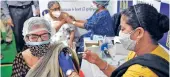 ??  ?? A woman being administer­ed a dose of the COVID-19 vaccine at a centre in Kolkata