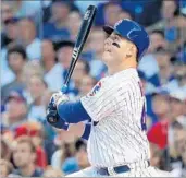  ?? BRIAN CASSELLA/CHICAGO TRIBUNE ?? Cubs first baseman Anthony Rizzo hits a tiebreakin­g RBI single during the eighth inning of Monday’s 2-1 victory.