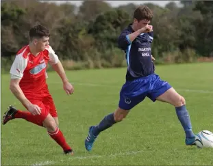  ??  ?? Jamie Myler of Campile United is chased by Luke Jordan of Kilmore United.