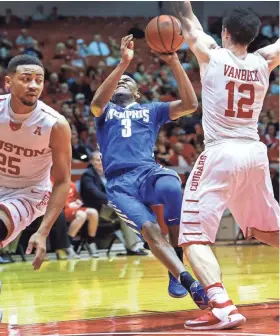  ?? PHOTOS BY MARK WEBER/THE COMMERCIAL APPEAL ?? University of Memphis guard Jeremiah Martin (middle) is fouled on a fast break while defended by University of Houston teammates Galen Robinson Jr. (left) and Wes VanBeck (right) during first half action at the Hofhienz Pavilion in Houston.