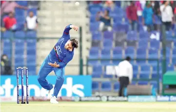  ??  ?? Afghanista­n spinner Rashid Khan in action. - AFP photo