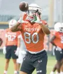  ?? MIKE STOCKER/ SOUTH FLORIDA SUN SENTINEL ?? Miami tight end Elijah Arroyo goes through drills during the first fall training camp practice on Aug. 5. Arroyo did not warm up with the Hurricanes before their game against North Carolina on Saturday.