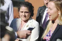  ??  ?? CHARLOTTES­VILLE: University of Virginia administra­tor Nicole Eramo, left, listens to attorney Libby Locke, right, speak with the media outside the federal courthouse. — AP