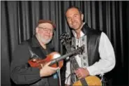  ??  ?? Celtic music star Charlie Zahm (right) and fiddler Tad Marks will be preforming at the State Theater on Fri. March 3 at 7 p.m.