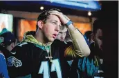  ?? JOE LAMBERTI/ASSOCIATED PRESS ?? A distraught Eagles fan in Philadelph­ia reacts after his team’s 38-35 loss to the Kansas City Chiefs on Sunday in Super Bowl LVII.