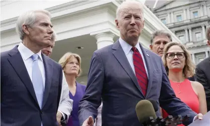  ??  ?? Rob Portman, left, listens to Joe Biden on Thursday. Photograph: Jacquelyn Martin/AP