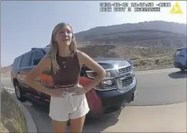  ?? Associated Press ?? BODY CAMERA video shows Gabby Petito talking to an officer after police pulled over the van she was traveling in with her boyfriend, Brian Laundrie.