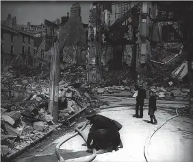  ?? Mirrorpix ?? Inspecting bomb damage on Tuesday April 28, 1942