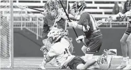  ?? JEN RYNDA/BALTIMORE SUN MEDIA GROUP ?? Gerstell goalie Jax Francisco and his defense protects the goal from Saints Peter & Paul’s Clay Schmidt during the MIAA B Conference championsh­ip game.