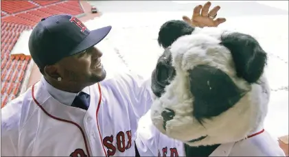  ?? AP FILE PHOTO ?? In this Nov. 25, 2014, file photo, then-boston Red Sox free agent third baseman Pablo Sandoval, nicknamed Kung Fu Panda, converses with a person dressed as a panda bear wearing a Red Sox jersey, overlookin­g a tarp-covered Fenway Park field in Boston.