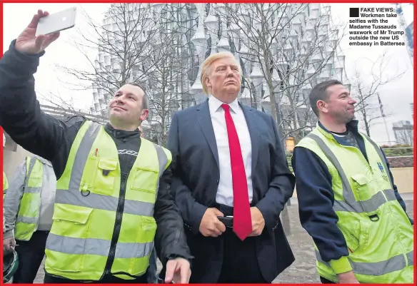  ??  ?? FAKE VIEWS: Workmen take selfies with the Madame Tussauds waxwork of Mr Trump outside the new US embassy in Battersea