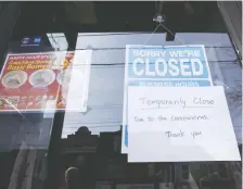  ?? COLE BURSTON/BLOOMBERG ?? Many businesses like this restaurant in Toronto have closed, leading to an “exodus of jobs” as the world combats COVID-19. The jobless rate could nearly double by next month.