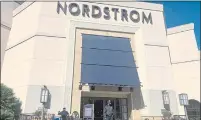  ?? EUGENE GARCIA — THE ASSOCIATED PRESS ?? A security guard stands outside the Nordstrom store at The Grove retail and entertainm­ent complex in Los Angeles on Nov. 23.