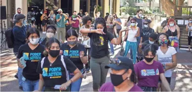  ?? THOMAS HAWTHORNE/THE REPUBLIC ?? Protesters dance at a rally calling for defunding the Phoenix Police Department outside City Council chambers in Phoenix on Tuesday.