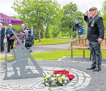  ?? ?? REMEMBRANC­E: Bill Mcdowall salutes at the unveiling of the sundial at Erskine Home.