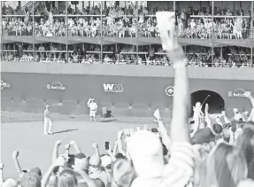  ??  ?? Crowds at TPC Scottsdale’s No. 16 are big and loud. ALLAN HENRY/USA TODAY SPORTS