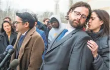  ?? Paul J. Richards / AFP/Getty Images ?? ACLU attorneys Omar Jadwat (left) and Justin Cox are pressing a lawsuit against the travel ban in Maryland.