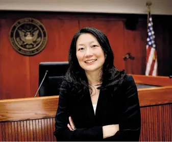  ?? Russell Yip / The Chronicle ?? Above: U.S. District Judge Lucy Koh, shown in her courtroom in San Jose, has handled many high-profile tech cases, including patent disputes and claims of collusion over workers’ pay.