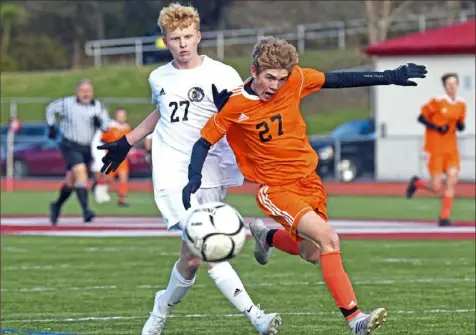  ??  ?? Greensburg Central Catholic’s Ryan Reitler, left, and Springdale’s Chris Mitchell go for the ball in a Class 1A quarterfin­al.