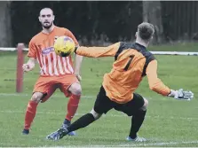  ??  ?? Josh Home-Jackson clips home his second goal for Ryhope CW.