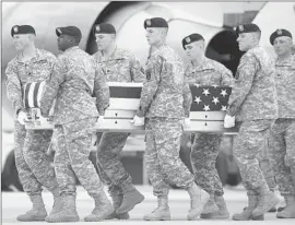  ?? Cliff Owen
Associated Press ?? THE REMAINS OF Army Sgt. Michael Cable, 26, of Kentucky arrive Sunday at Dover Air Force Base in Delaware. Cable died Wednesday in Afghanista­n.