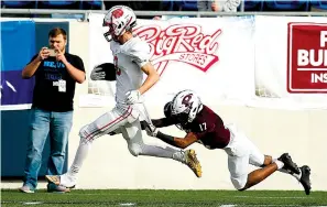  ?? Photo by Thomas Metthe/Arkansas Democrat-Gazette ?? ■ Harding Academy wide receiver Landon Koch shakes off Prescott defensive back Armani Tidwell for a 58-yard touchdown Saturday in the third quarter of the Wildcats’ 47-25 win in the Class 3A state championsh­ip game at War Memorial Stadium in Little Rock.