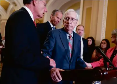  ?? J. SCOTT APPLEWHITE/ASSOCIATED PRESS ?? Senate minority leader Mitch McConnell was helped after freezing up on Wednesday.