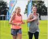  ??  ?? Sprint for home . . . Jackie Ollerensha­w (left) and Anna Milne cross the finish line of the Ken Milne Classic event in Balclutha on Saturday. Mrs Milne is the daughterin­law of the former Clutha rugby coach for whom the event is named.