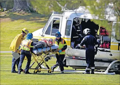  ?? Ricardo DeAratanha Los Angeles Times ?? A VICTIM is transporte­d to a rescue helicopter after a small plane crashed at the Westlake Golf Course in Westlake Village, Calif., in 2013.