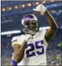  ?? PAUL SANCYA — THE ASSOCIATED PRESS ?? Minnesota Vikings running back Latavius Murray looks towards the stands after scoring on a two-yard run during the second half of an NFL football game against the Detroit Lions Thursday in Detroit.