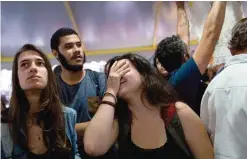  ??  ?? RIO DE JANEIRO: A woman reacts to a national address by Brazil’s President Michel Temer in which he said he would not resign in Rio de Janeiro. —AP