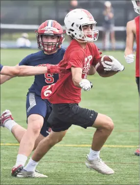  ?? Dave Stewart / Hearst Connecticu­t Media ?? Fairfied Prep receiver James Iaropoli runs for a few yards after a catch during the Grip It and Rip It football tournament in New Canaan in July.