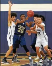  ?? AUSTIN HERTZOG - DIGITAL FIRST MEDIA ?? Upper Merion’s KJ Pugh (35) kicks the ball out after pulling down an offensive rebound against Pottstown.