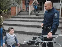  ??  ?? Const. Brian Harper shows the Medicine Hat Police Service's bomb robot to Sami Gharzeddin e Saturday during Law Day.