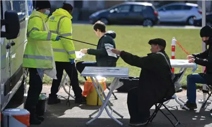  ?? Photograph: Daniel Leal-Olivas/ AFP/Getty Images ?? People take Covid-19 tests at a mobile surge testing centre in Brockwell Park, south London, on 13 April.