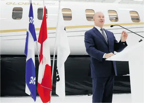  ?? ALLEN MCINNIS / POSTMEDIA NEWS ?? Bombardier CEO Alain Bellemare stands in front of a Global 7000 jet at a press conference in Montreal on Tuesday, when it was announced that the Canadian government will give Bombardier $372.5 million in repayable loans.