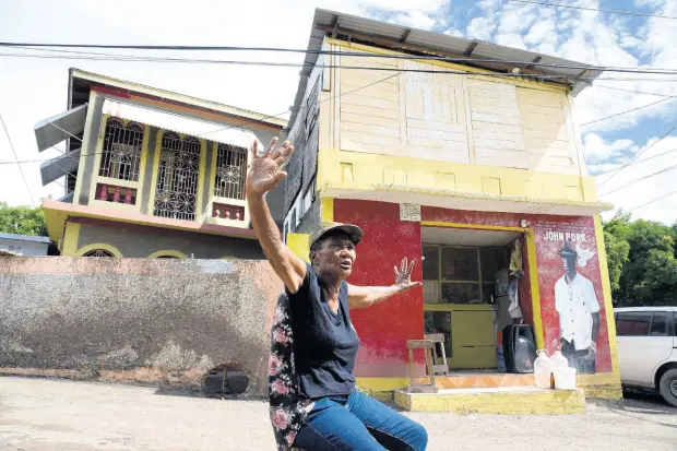  ?? PHOTOS BY NICHOLAS NUNES/PHOTOGRAPH­ER ?? Seventy-four-year-old Carmeta Austin of Weise Road in Bull Bay, St Andrew, said that like her, most of the residents there had either leased or purchased their properties and were not squatters.