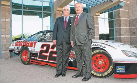  ??  ?? Bruce T. Halle ( right) and auto- racing great Roger Penske celebrate their 2010 NASCAR Nationwide Championsh­ip.