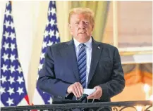  ?? REUTERS ?? U.S. President Donald Trump poses on the Truman Balcony of the White House in Washington on Monday after returning from being hospitaliz­ed at Walter Reed Medical Center for COVID-19 treatment.