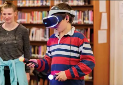  ?? CARRIE GARLAND — FOR THE NEWS-HERALD ?? An Andrews Osborne student uses a virtual reality game during Extra Life Game Day, which raises funds for children’s hospitals. The event was held Nov. 3 in Willoughby.