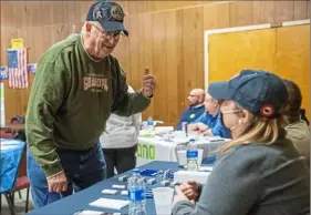  ?? Emily Matthews/Post-Gazette ?? Don McCracken, an Air Force veteran and resident of Ambridge, left, talks with Brianne Miller and Ken Haynes, with the Veterans Leadership Program, during a veterans advocacy day event on Sunday at Veterans of Foreign Wars Vesle Post 418 in McKees Rocks.