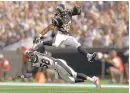  ?? EA SPORTS ?? Los Angeles Rams’Todd Gurley leaps over the Broncos’Von Miller in the “Madden NFL 17” version of a pro football game.