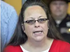  ?? TIMOTHY D. EASLEY/THE ASSOCIATED PRESS FILE PHOTO ?? Kim Davis, a clerk who refused to issue gay marriage licences, said she got words of encouragem­ent from the Pope, but the Vatican denies her claims.