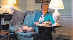  ??  ?? Nicola Sturgeon works on her letter to Theresa May