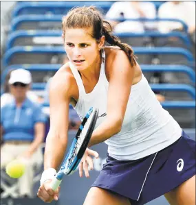  ?? Peter Hvizdak / Hearst Connecticu­t Media ?? Julia Goerges volleys against Dominika Cibulkova on Stadium Court during the Connecticu­t Open Sunday in New Haven.