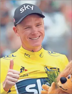  ??  ?? Chris Froome, wearing the overall leader’s yellow jersey, celebrates on the podium Saturday after the 20th stage of the Tour de France.