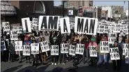  ?? MARK HUMPHREY — THE ASSOCIATED PRESS ?? People hold signs resembling the signs carried by striking sanitation workers in 1968 as they join in events commemorat­ing the 50th anniversar­y of the assassinat­ion of the Rev. Martin Luther King Jr.