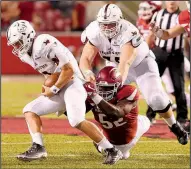  ?? NWA Democrat-Gazette file photo ?? Arkansas sophomore defensive end T.J. Smith (52), shown last season against Texas State, has gone from 283 pounds to 298 since the end of spring practice while maintainin­g his speed.